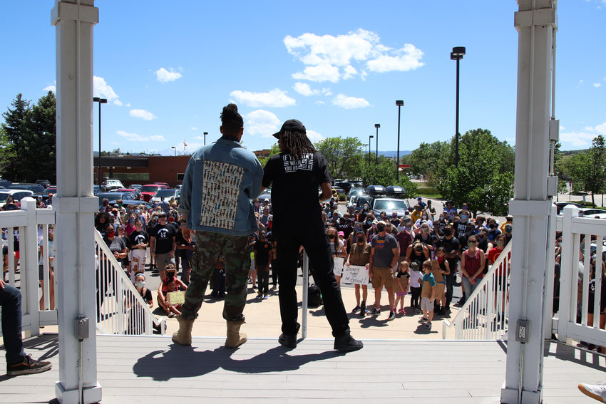 Jourdan Henderson and Quincy Shannon speak to crowds at the June 7 protest in Castle Rock.